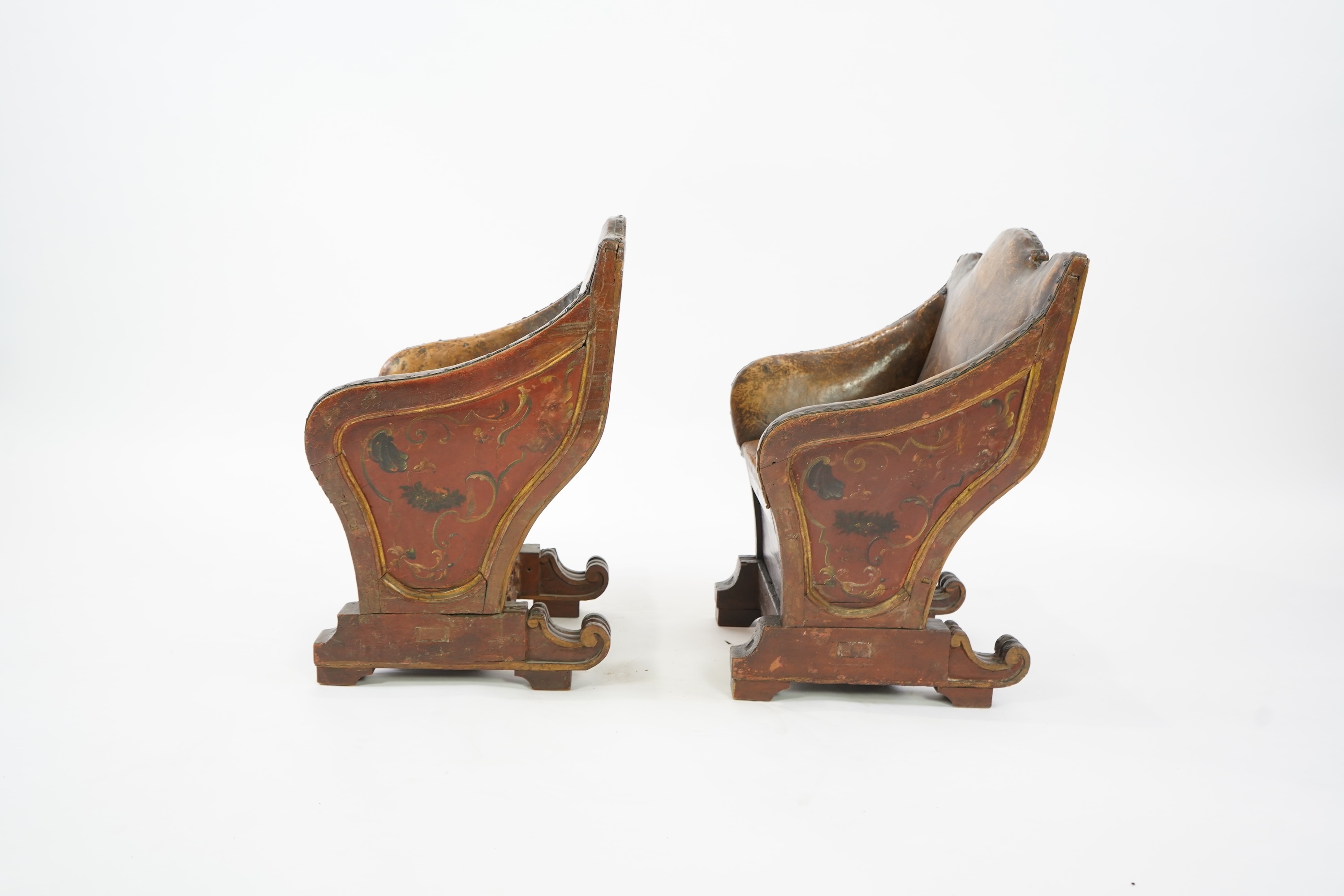 A pair of 19th century Venetian carved wood and tan leather Gondola seats